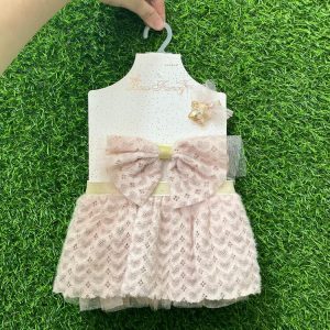 Vincha y faldita rosa con moño de encaje